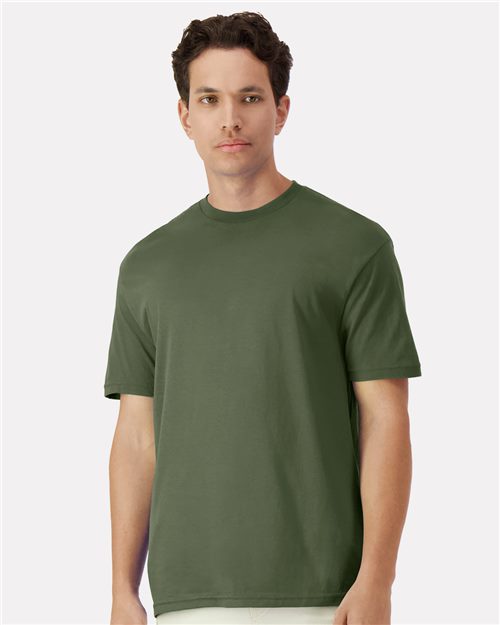 Man wearing a green t-shirt against a white background